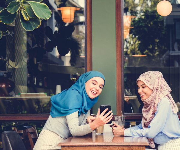 Islamic,Friends,Talking,And,Looking,On,The,Smart,Phone